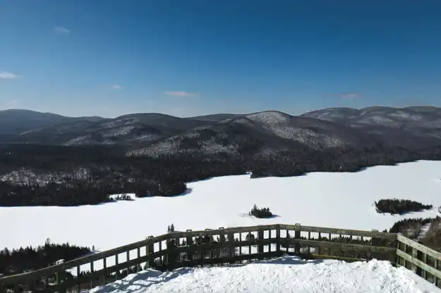 View of the snow-capped mountains from a Mont Tremblant chalet for sale